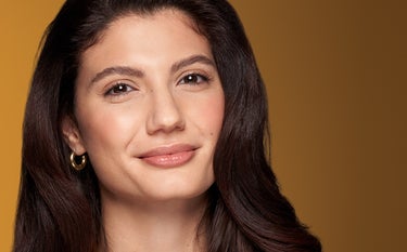 A woman with a confident look after treating her frown lines